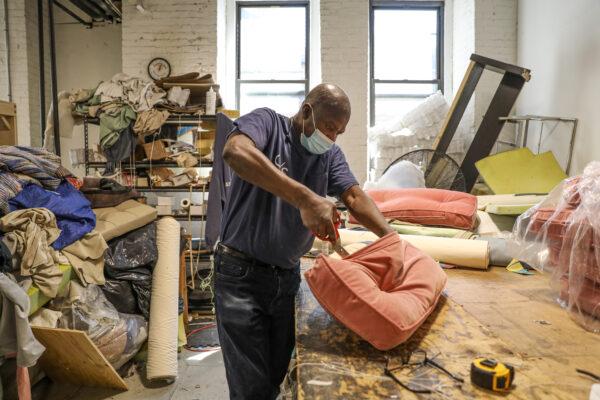 A craftsman working at the Bronx factory of custom furniture maker Classic Sofa, New York City on May 6, 2021. (Samira Bouaou)