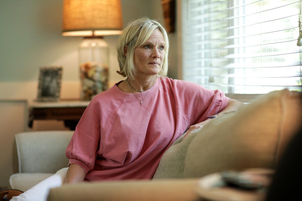 Michele Holbrook sits at her home in Fernandina Beach, Fla., on May 19, 2021. (Samira Bouaou/The Epoch Times)