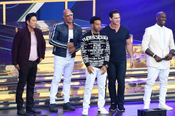 (L-R) Sung Kang, Vin Diesel, Ludacris, John Cena, and Tyrese Gibson speak onstage during Universal Pictures Presents The Road To F9 Concert and Trailer Drop in Miami on Jan. 31, 2020. (Kevin Winter/Getty Images for Universal Pictures )