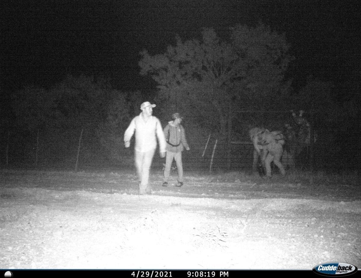 Illegal immigrants are captured on a game camera as they traverse Cole Hill’s ranch in Kinney County, Texas. (Courtesy of Cole Hill)