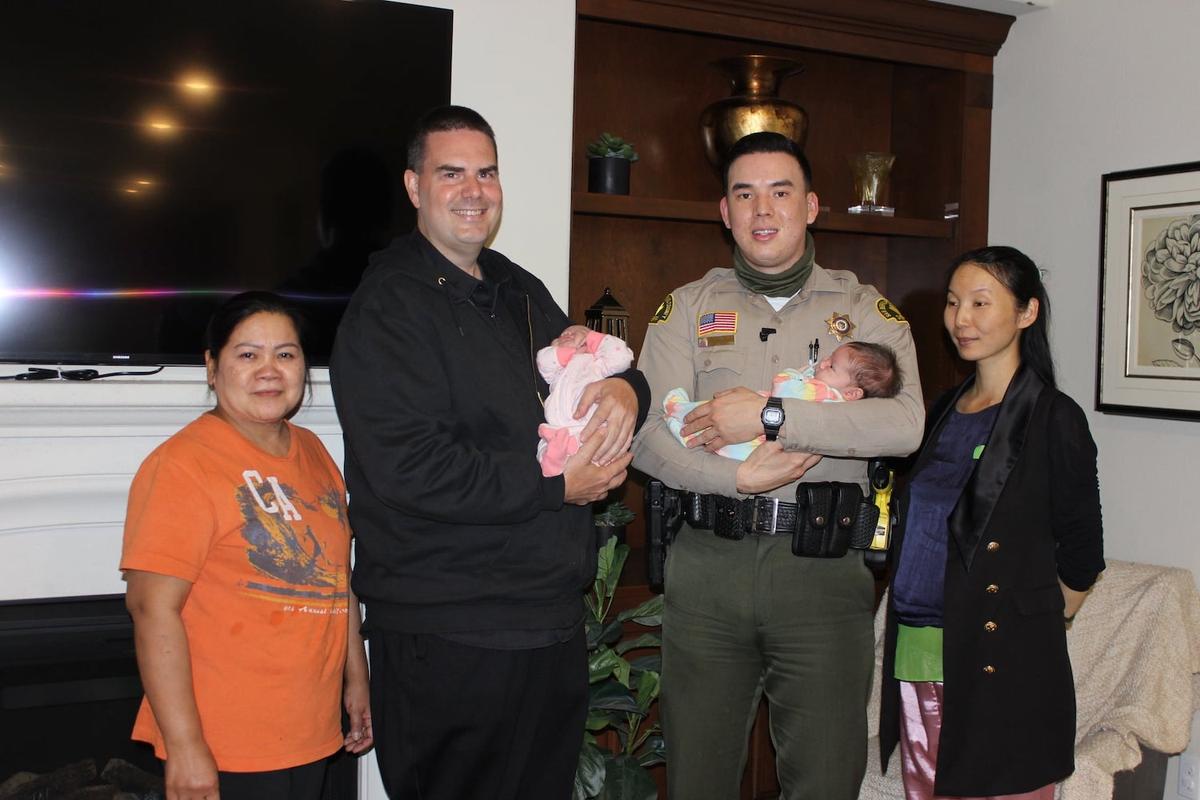 Kelly with the twins' father, Glen Wood, and the rest of the family. (Courtesy of <a href="https://wp.sbcounty.gov/sheriff/">San Bernardino County Sheriff's Department</a>)