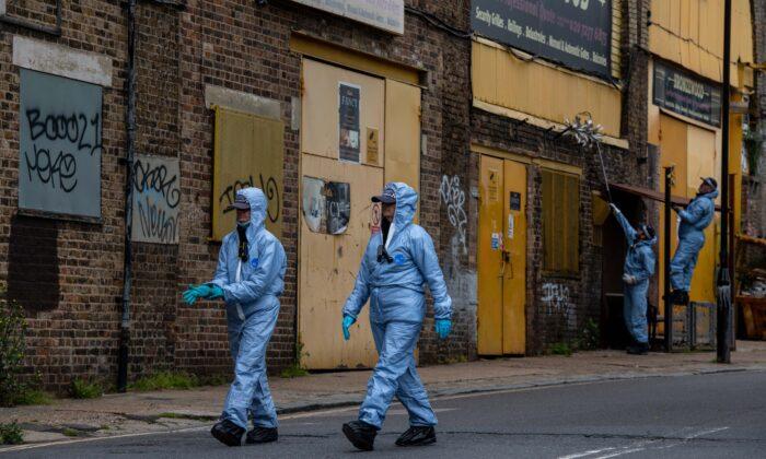 Police forensic officers on Consort Road as they investigate the shooting of Sasha Johnson in London on May 24, 2021. (Chris J Ratcliffe/Getty Images)