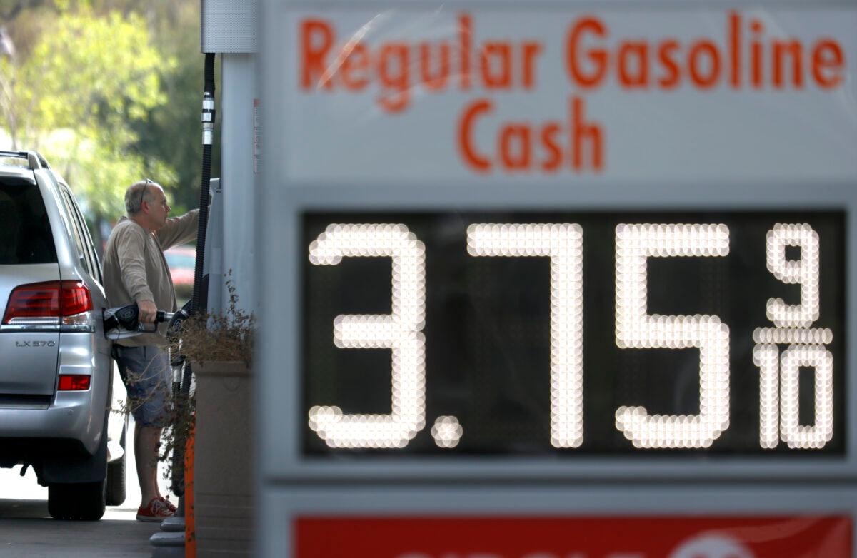 A customer at a 76 gas station in San Anselmo, Calif., on March 3, 2021. (Justin Sullivan/Getty Images)