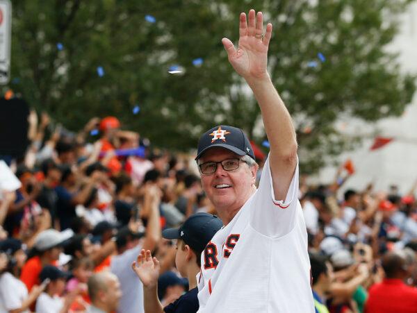 Texas Lt. Gov. Dan Patrick waves to the crowd during the Houston Astros Victory Parade in Houston, Texas, on Nov. 3, 2017. (Bob Levey/Getty Images)