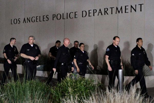 Los Angeles police officials arrive for a media briefing outside the police administration headquarters in this file photo. (Jonathan Alcorn/Getty Images)