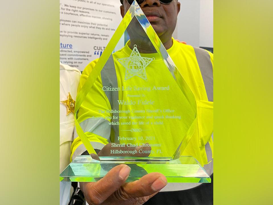 Waldo Fidele with his award. (Courtesy of <a href="https://teamhcso.com/">Hillsborough County Sheriff's Office</a>)