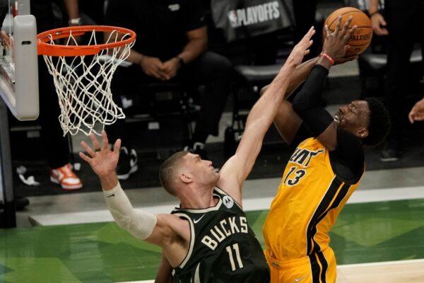 Miami Heat's Bam Adebayo shoots over Milwaukee Bucks' Brook Lopez during the first half of Game 1 of their NBA basketball first-round playoff series in Milwaukee, Wis., on May 22, 2021. (Morry Gash/AP Photo)
