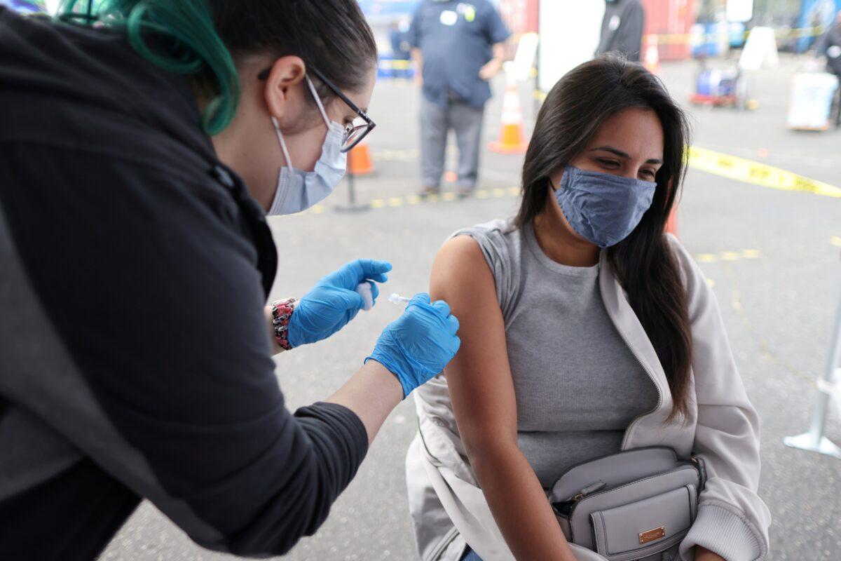 Esperanza Guevara, 31, receives a Johnson & Johnson COVID-19 vaccine in Los Angeles, Calif., on March 25, 2021. (Lucy Nicholson/Reuters)