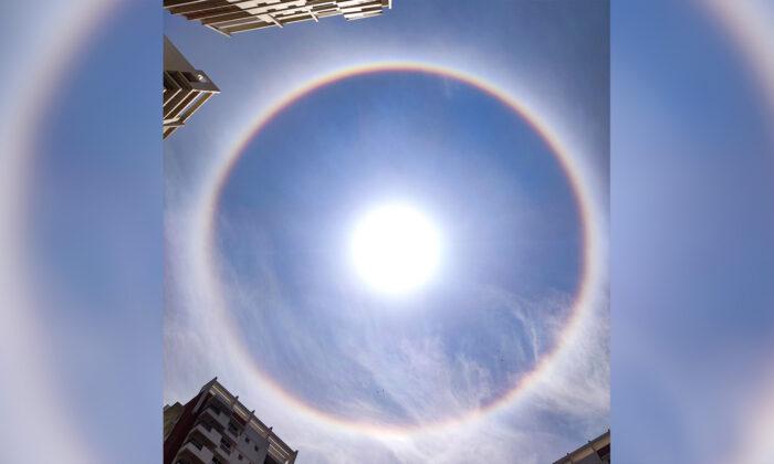 Skywatchers Witness Breathtaking Rainbow Halo Around the Sun Over City in Southern India