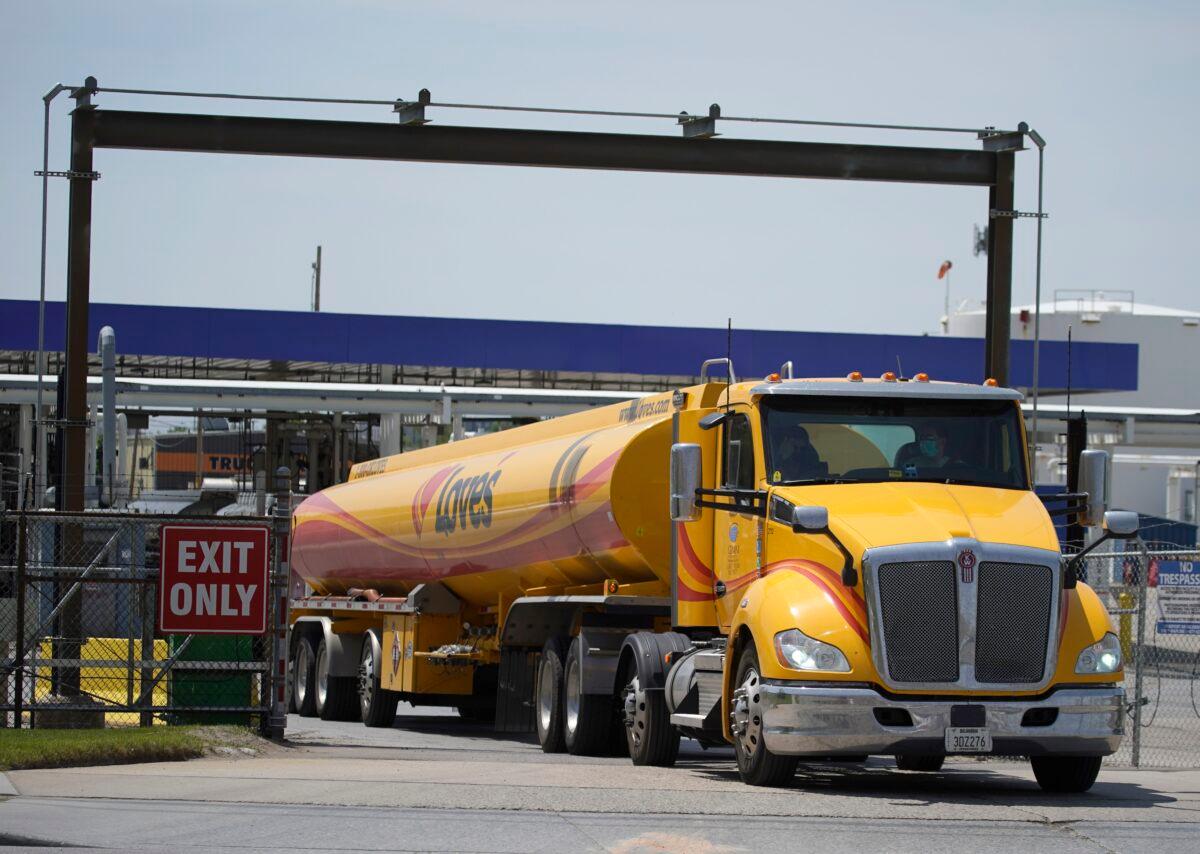 A driver leaves the yard after filling up his gas tanker truck at Marathon Oil in Salt Lake City on May 20, 2021. (George Frey/Getty Images)