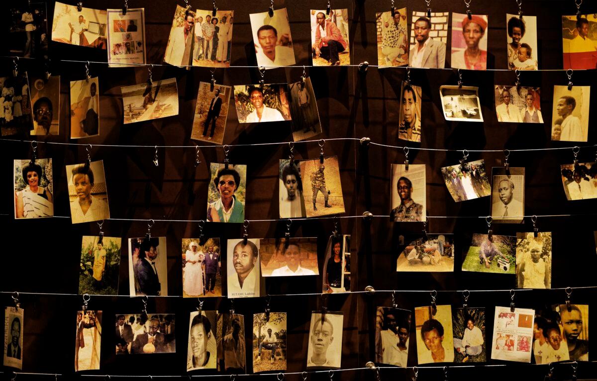 Family photographs of some of those who died hang on display in an exhibition at the Kigali Genocide Memorial center in the capital Kigali, Rwanda, on April 5, 2019. (Ben Curtis/AP Photo)