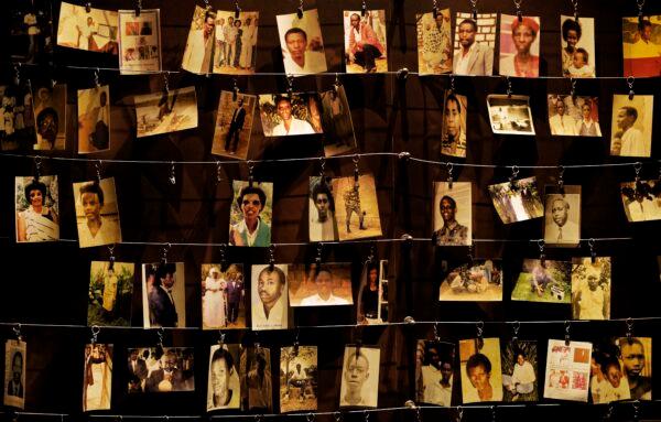 Family photographs of some of those who died hang on display in an exhibition at the Kigali Genocide Memorial centre in the capital Kigali, Rwanda, on April 5, 2019. (Ben Curtis/AP Photo)
