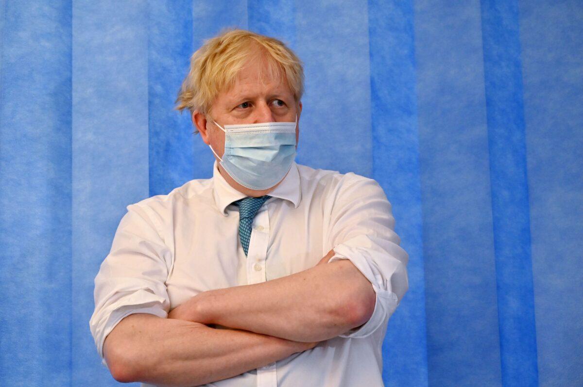 Britain's Prime Minister Boris Johnson visits Colchester hospital in Colchester, eastern England, on May 27, 2021. (Glyn Kirk/Pool/AFP via Getty Images)