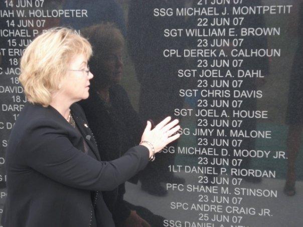 Dee at the Fort Hood, Texas, Iraqi Freedom Memorial Monument beside her son’s name. (Courtesy of <a href="https://www.facebook.com/DeeHouse">Deanna House</a>)