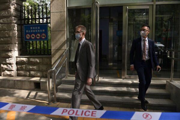 Australian Ambassador to China Graham Fletcher (L) walks out from an entrance to the Beijing Second Intermediate People's Court after being refused access to the trial of Australian academic Yang Jun, also known as Yang Hengjun, on espionage charges in Beijing on May 27, 2021. (Nicolas Asfouri/AFP via Getty Images)