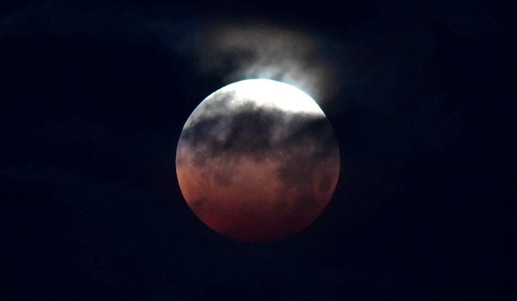 The Moon over Santa Monica, California, on May 26, 2021, during the "Super Blood Moon" total eclipse. (Frederic J. Brown/AFP via Getty Images)