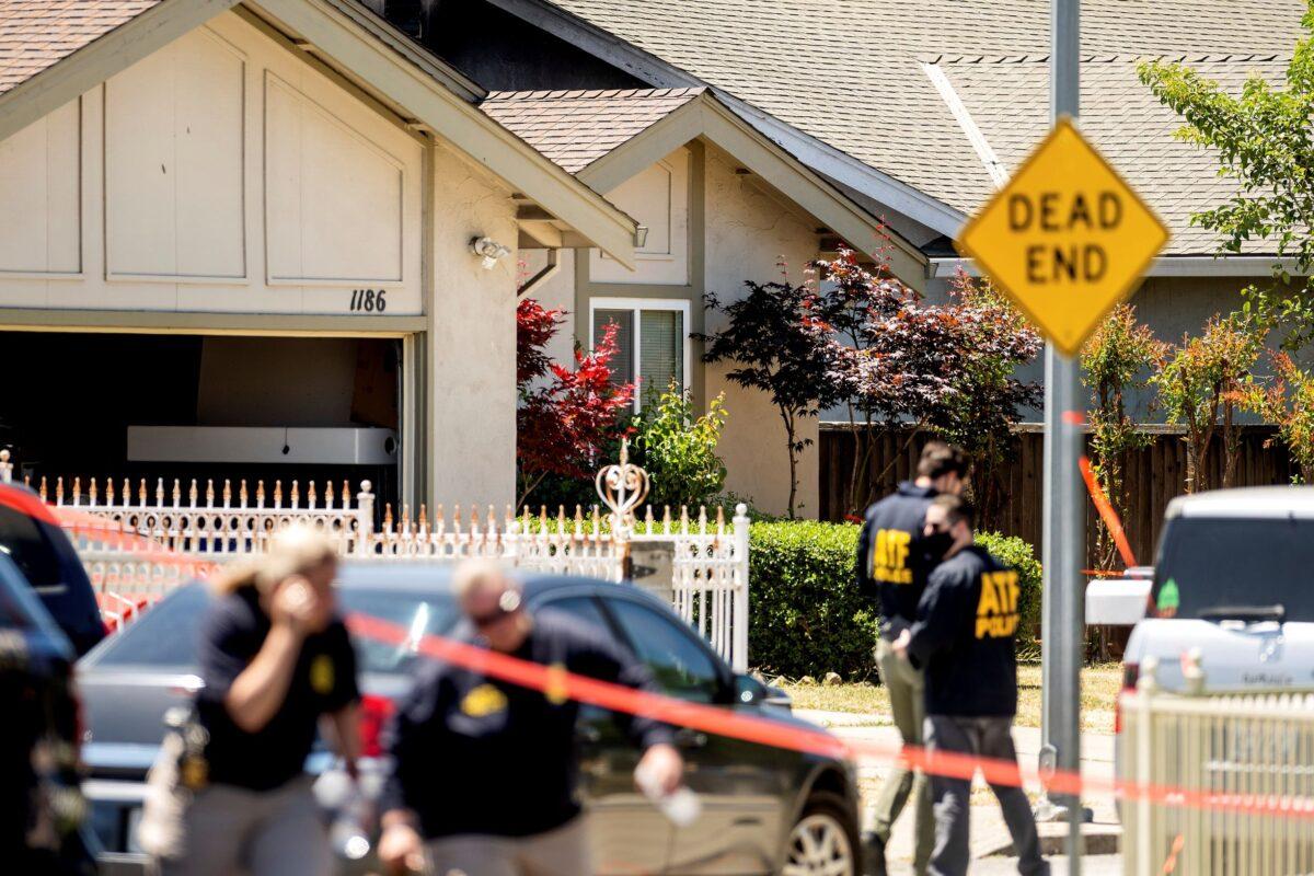 FBI agents approach a home, rear, being investigated in connection to a shooting at a Santa Clara Valley Transportation Authority (VTA) facility in San Jose, Calif., on May 26, 2021. (Noah Berger/AP Photo)