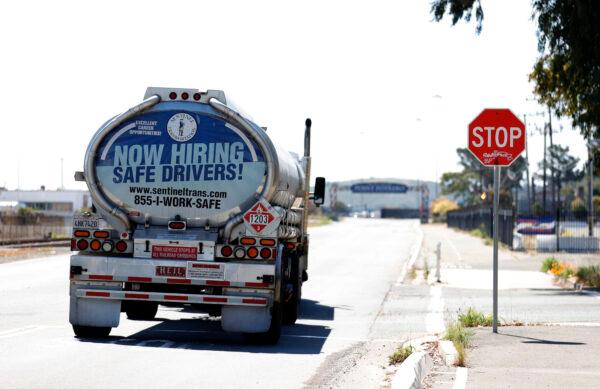A now hiring advertisement appears on the back of a fuel truck in Richmond, Calif., on April 29, 2021. (Justin Sullivan/Getty Images)