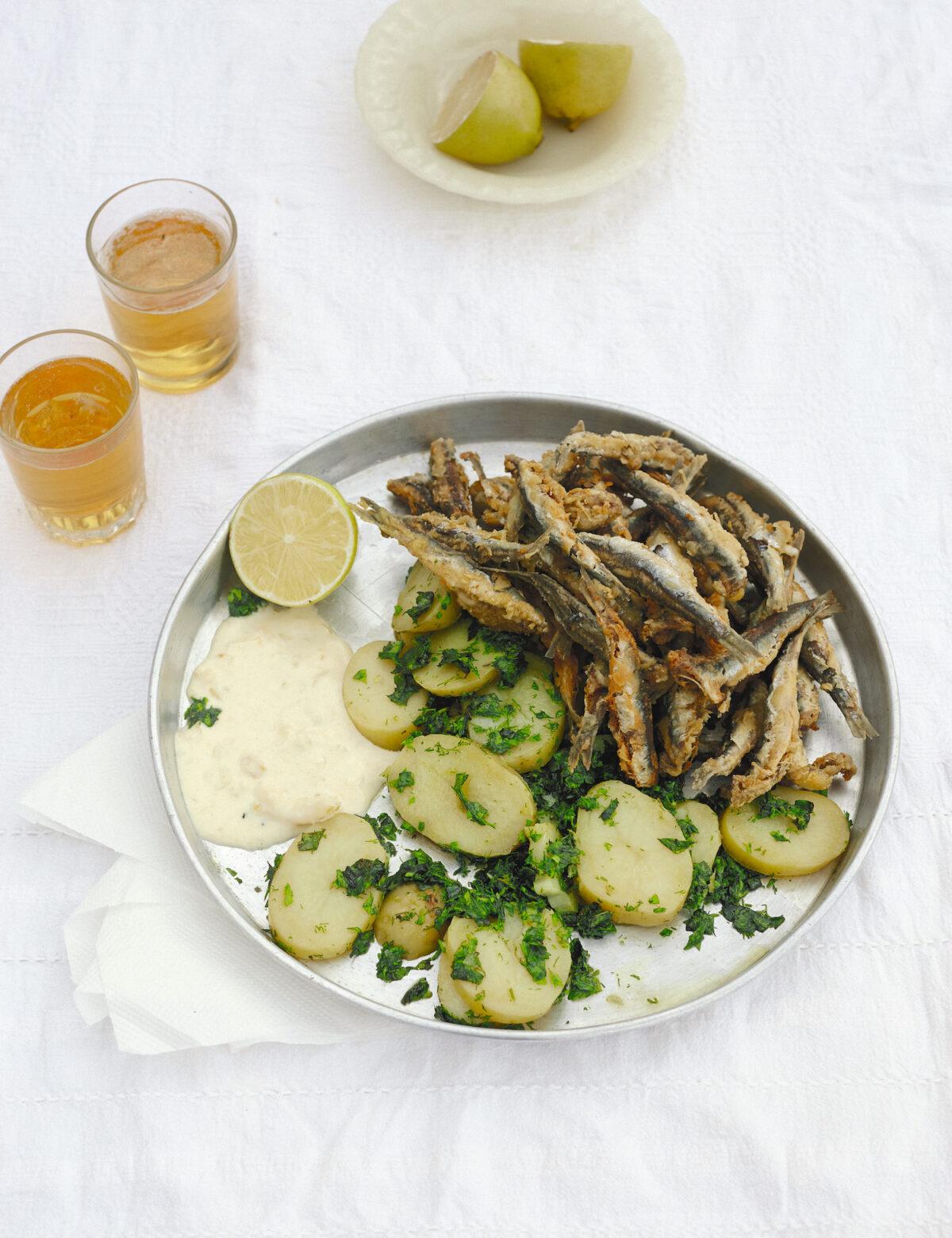 Fried anchovies with potatoes, chopped herbs, and lemon mayonnaise. (Elena Heatherwick)