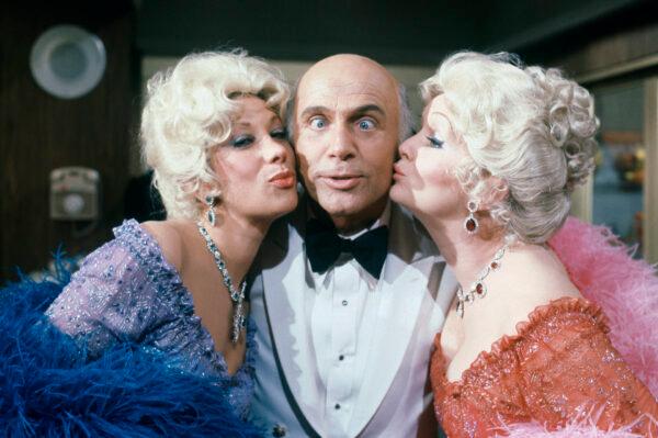 Gavin MacLeod with actress Debbie Reynolds and Marilyn Michaels on the set of "The Love Boat" on Oct. 15, 1982. (Doug Pizac/AP Photo, File)