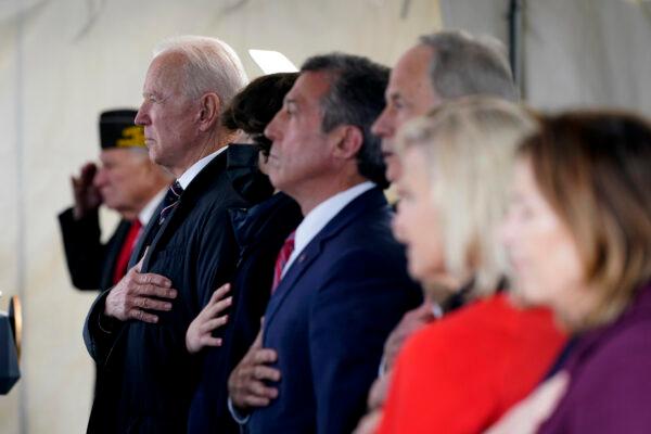 President Joe Biden stands as a rendition of the national anthem is performed during a Memorial Day event at Veterans Memorial Park at the Delaware Memorial Bridge in New Castle, Del., on May 30, 2021. (Patrick Semansky/AP Photo)
