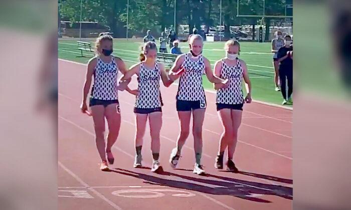 Video Shows Track Team Helping Fellow Runner Battling Cancer Cross Finish Line—and It Goes Viral