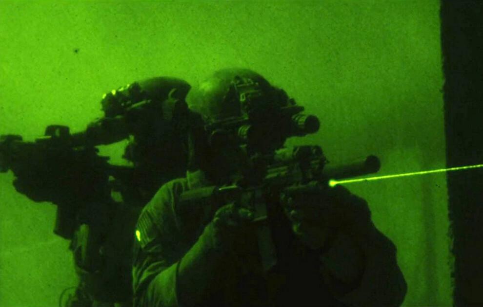 Members of U.S. Navy SEAL Team Six using night vision devices and laser sights in the hunt for Osama bin Laden, in "Zero Dark Thirty." (Jonathan Olley/Columbia Pictures)