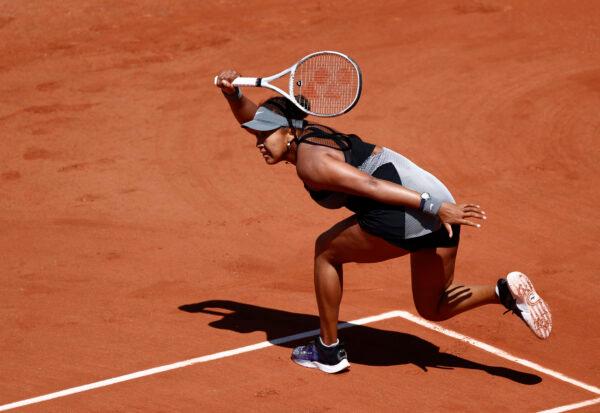 Japan's Naomi Osaka in action during her first round match against Romania's Patricia Maria Tig, in French Open—Roland Garros, in Paris, France, on May 30, 2021. (Christian Hartmann/Reuters)