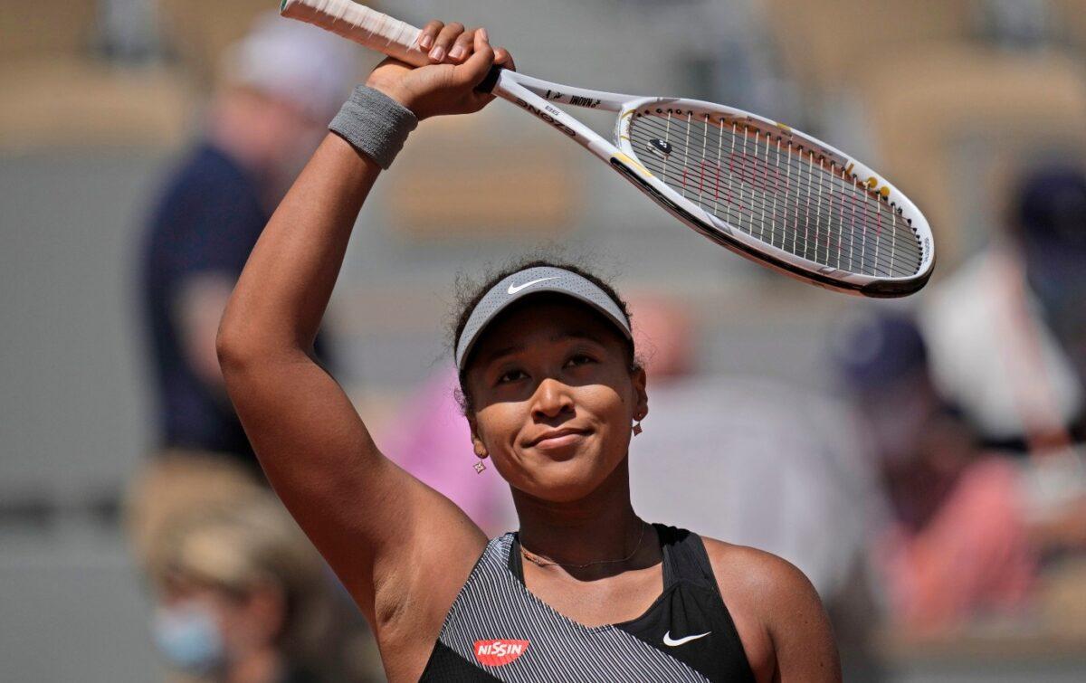 Japan's Naomi Osaka celebrates after defeating Romania's Patricia Maria Tig during their first round match of the French Open tennis tournament at the Roland Garros stadium, in Paris, France, on May 30, 2021. (Christophe Ena/AP Photo)