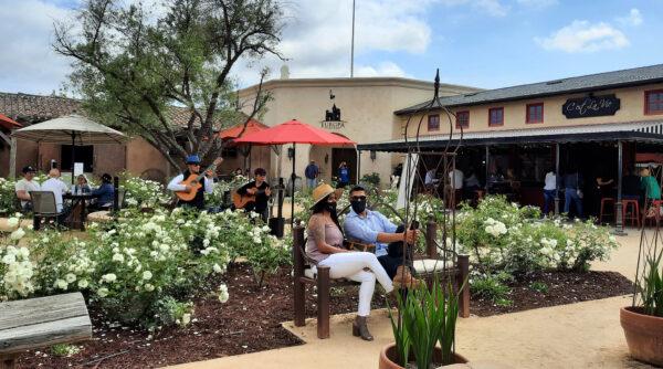 Visitors pause to listen to mariachi music outside Bolero at Europa Village in Temecula, Calif. (Courtesy of Jim Farber)