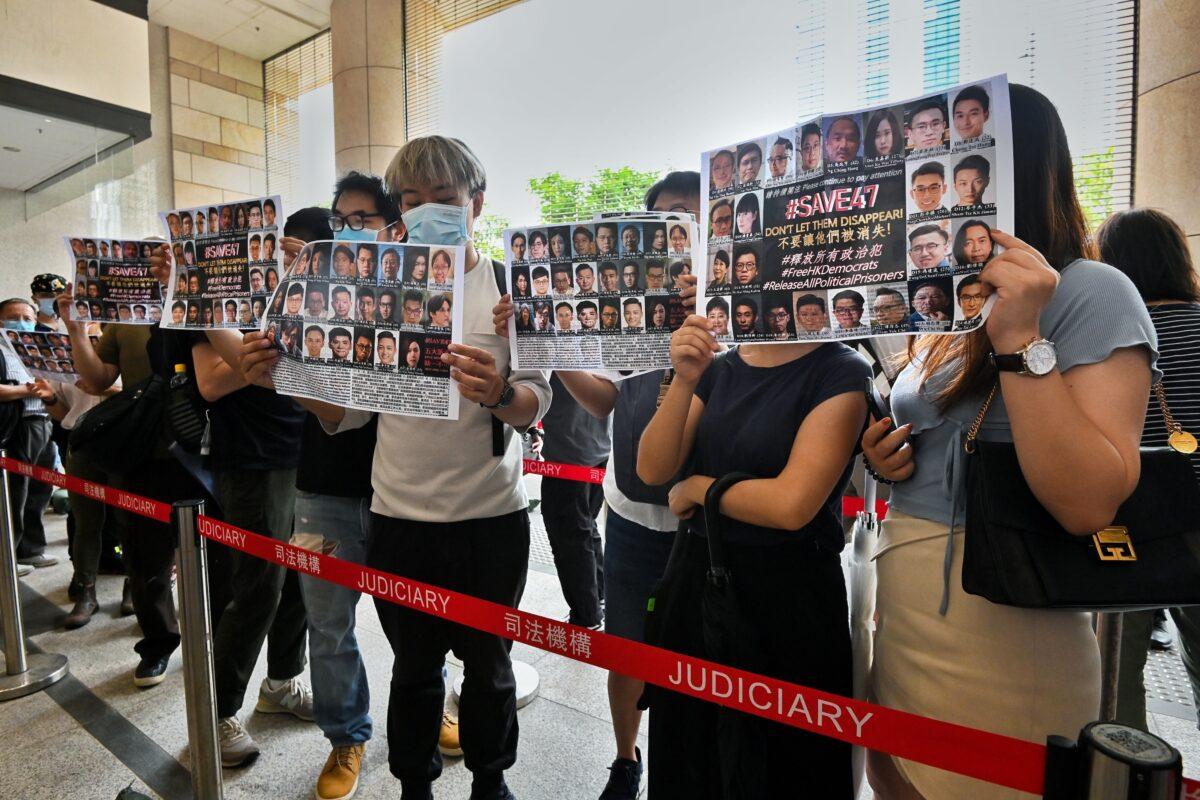 People show their support for the 47 pro-democracy opposition figures outside of the West Kowloon court building in Hong Kong on May 31, 2021. (Sung Pi-lung/The Epoch Times)
