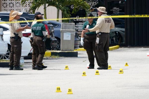 Law enforcement officials work the scene of a shooting outside a banquet hall near Hialeah, Fla., on May 30, 2021. (Lynne Sladky/AP Photo)