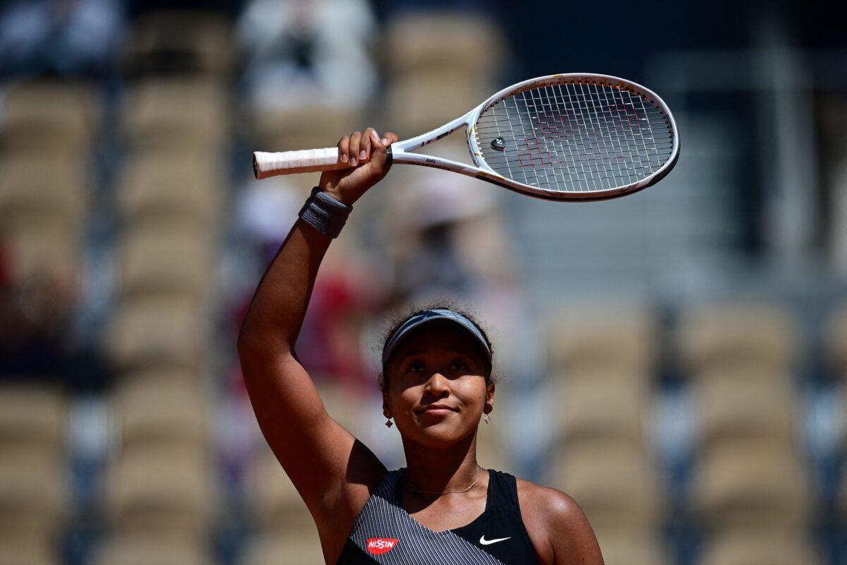 Naomi Osaka celebrates after winning against Romania's Patricia Maria Tig during their women's singles first round tennis match on Day 1 of The Roland Garros 2021 French Open tennis tournament in Paris on May 30, 2021. (Martin Bureau/AFP via Getty Images)