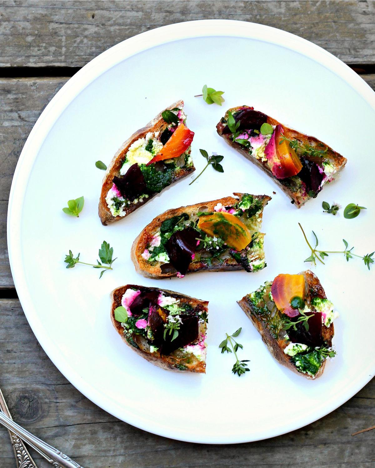 This piece of sandwich art features creamy goat cheese, roasted baby beets, and a vibrant garden pesto. (Lynda Balslev for Tastefood)