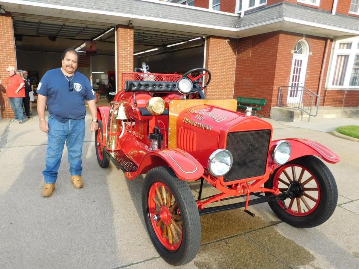 Larry Manaro standing next to the refurbished 1917 Model T fire engine. (Courtesy of Diz Dean via <a href="https://www.facebook.com/McDonald-Fire-Department-Social-Organization-MFDSO-145039486046025/">McDonald Fire Department Social Organization</a>)