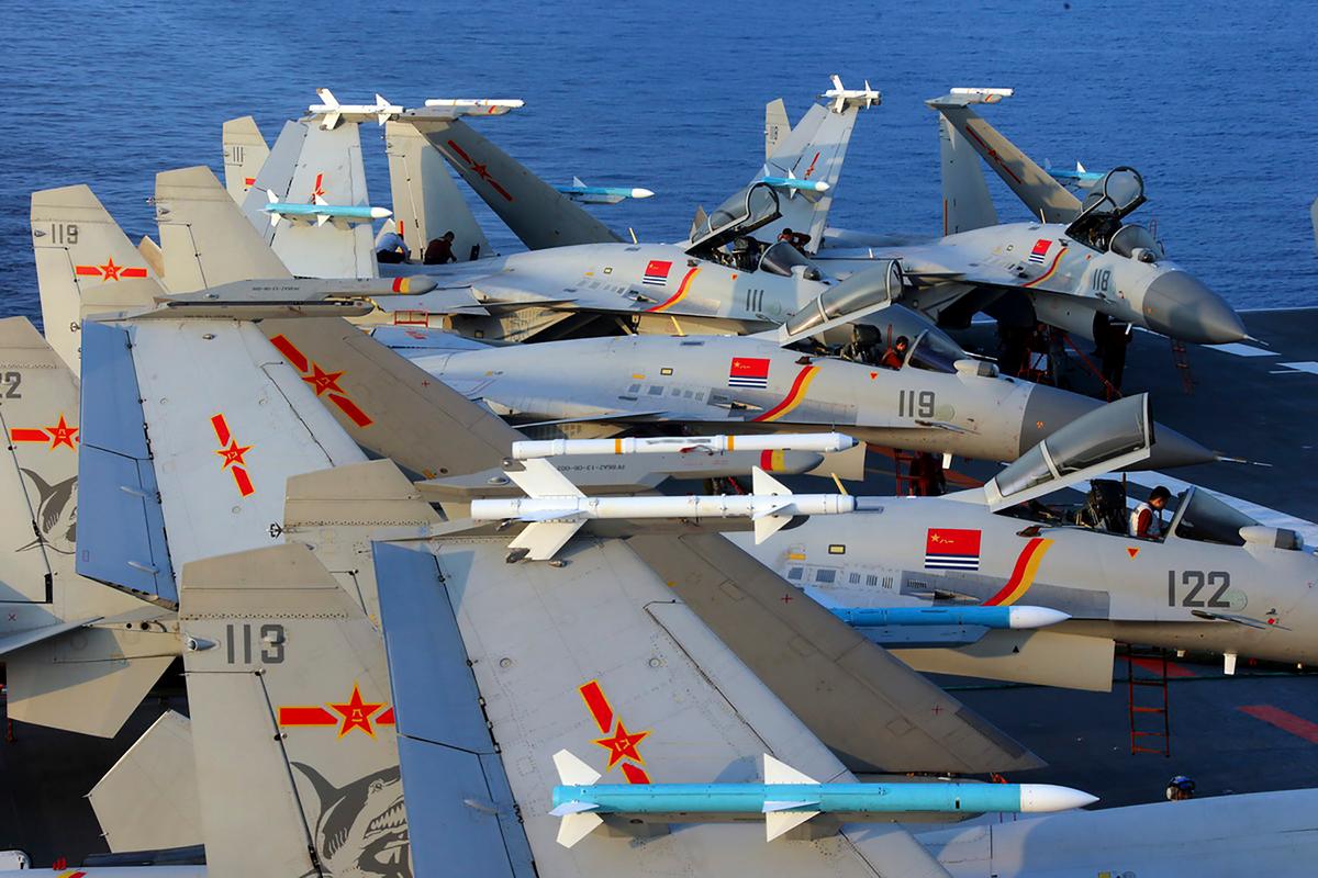 J15 fighter jets on China's sole operational aircraft carrier, the Liaoning, during a drill at sea in April 2018. (China OUT/AFP via Getty Images)