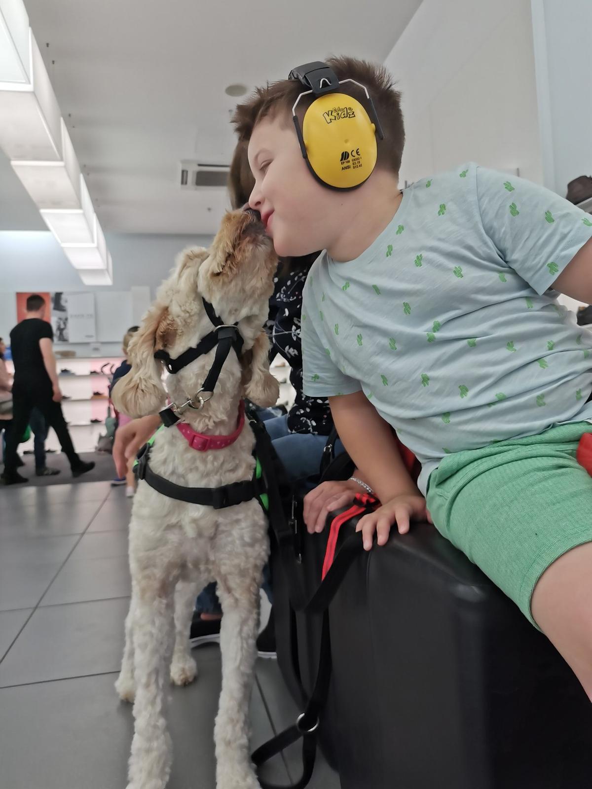 Riley with Willow while shopping for a new pair of shoes for school. (Courtesy of <a href="https://www.facebook.com/myboyblue2017/">Nicole Duggan</a>)