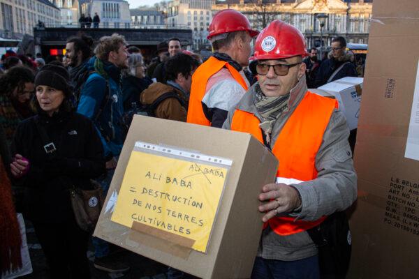 A group of protesters calling themselves 'Watching Alibaba,' are in the streets of Liège, Belgium, on Jan. 17, 2020. They are protesting against the arrival of online web shop Alibaba to the Liège region. (Thomas Michiels/Belga Mag/AFP via Getty Images)
