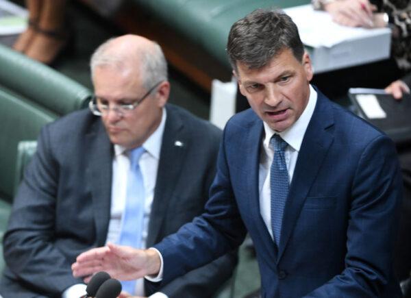 Energy and Emissions Minister Angus Taylor speaks next to Prime Minister Scott Morrison in the House of Representatives at Parliament House in Canberra, Australia, on Feb. 11, 2020. (Photo by Tracey Nearmy/Getty Images)