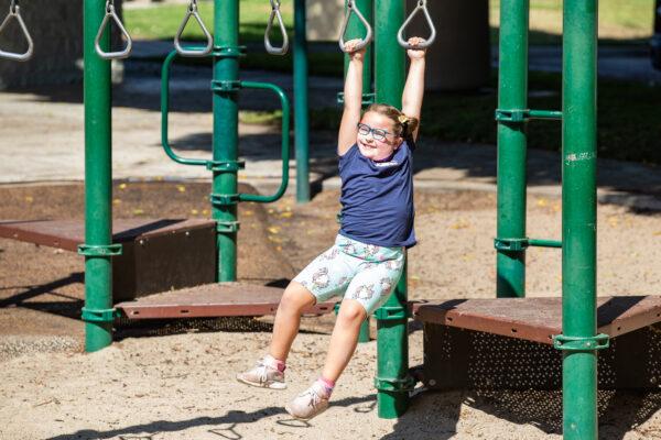 8-year-old writer Kiara "Kiwi" Smith hangs out at a playground in Brea, Calif., on May 24, 2021. (John Fredricks/The Epoch Times)