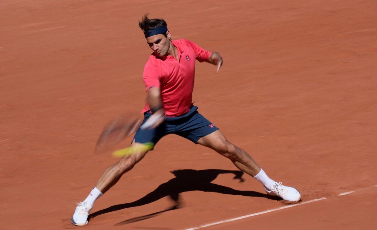 Switzerland's Roger Federer plays a return to Uzbekistan's Denis Istomin during their first round match on day two of the French Open tennis tournament at Roland Garros in Paris, France, Monday, May 31, 2021. (Thibault Camus/AP Photo/)