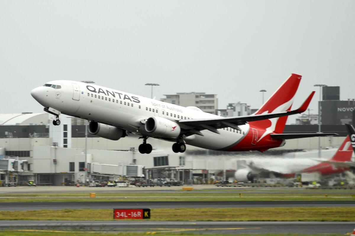 A Qantas plane takes off from the Sydney International Airport on May 6, 2021. (Saeed Khan/AFP via Getty Images)