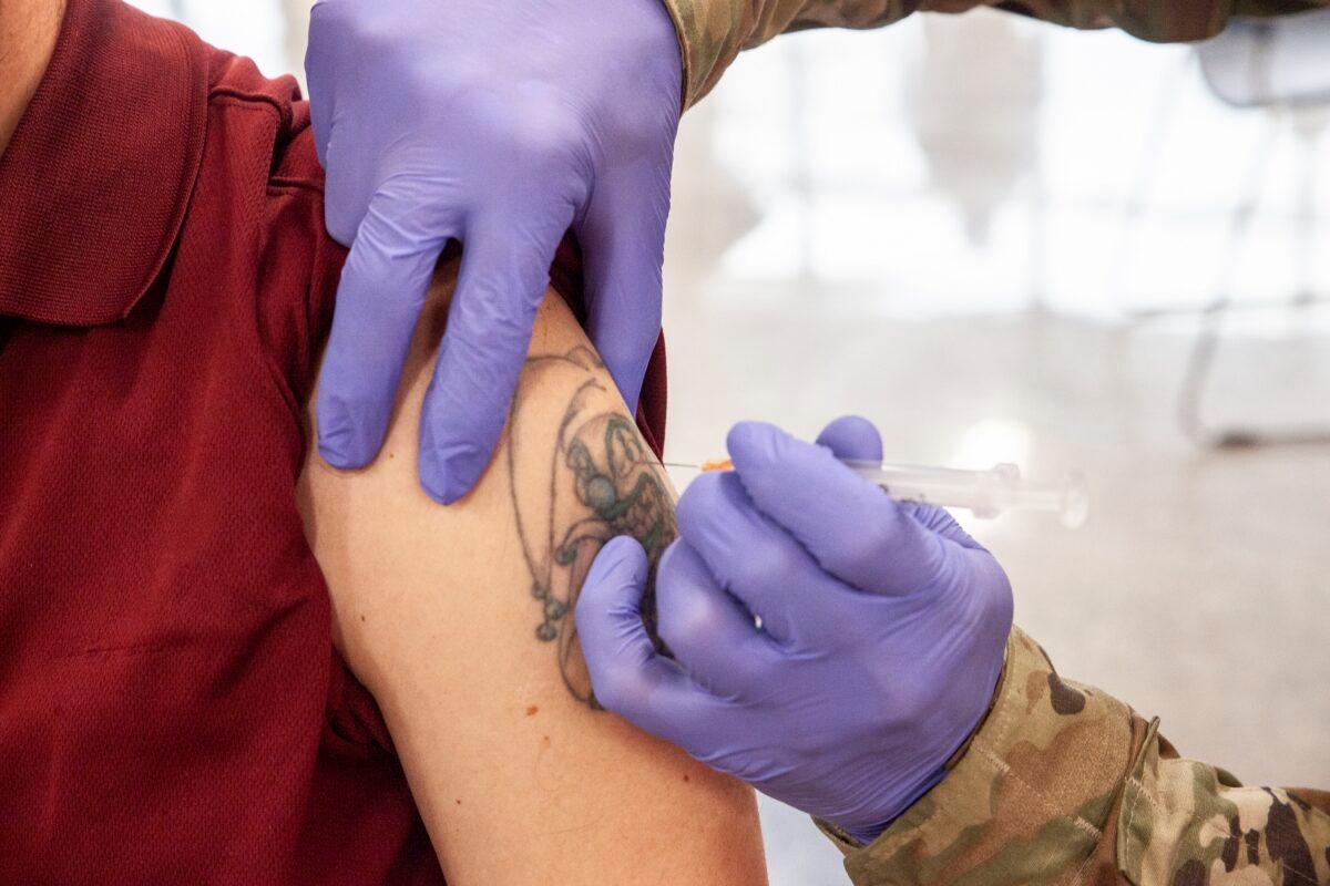 A man gets a COVID-19 vaccine in Buffalo, W.Va., on March 26, 2021. (Stephen Zenner/Getty Images)