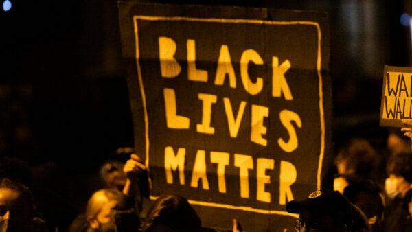 Demonstrators holding placards reading "Black Lives Matter" during a protest in Philadelphia, Pa., on Oct. 27, 2020. (Mark Makela/Getty Images)
