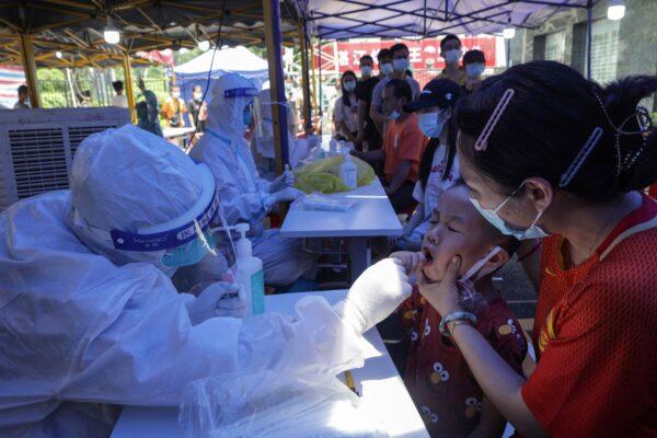 A child is tested for COVID-19 in Guangzhou in China's southern Guangdong province on May 30, 2021. (AFP via Getty Images)