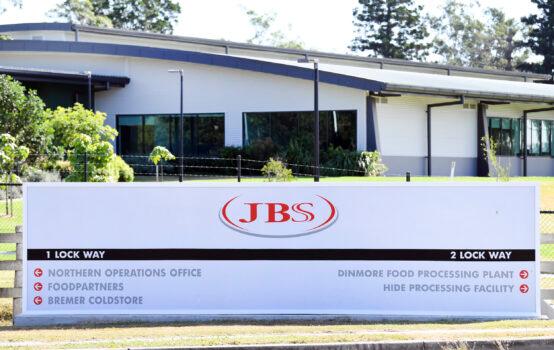 The company logo sign sits at the entrance to the JBS Australia's Dinmore meatworks facility, west of Brisbane, on May 12, 2020. (Dan Peled/AAP Image via AP)