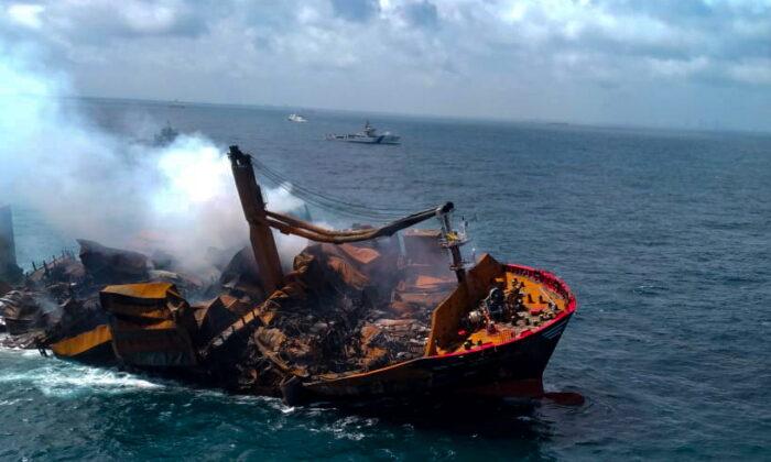 Smoke rises from a fire aboard the MV X-Press Pearl vessel as it sinks while being towed into deep waters off the Colombo harbor, in Sri Lanka, on June 2, 2021. (Sri Lanka Airforce Media/via Reuters)