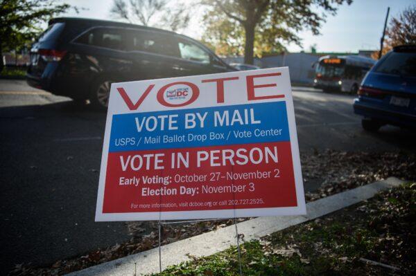 A sign urging people to vote is seen during the U.S. general election in Washington, on Nov. 3, 2020. (Nicholas Kamm/AFP via Getty Images)