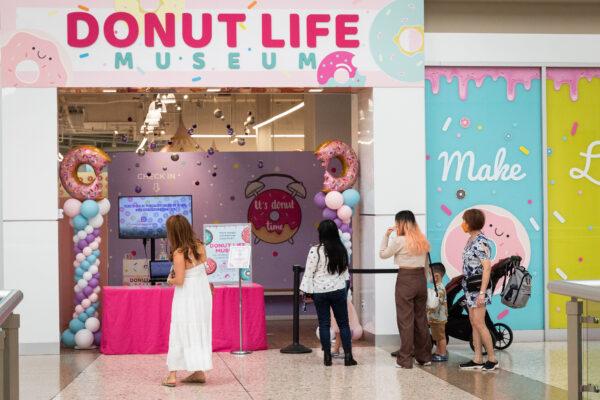 Visitors wait to enter the Donut Life Museum in Westminster, Calif., on May 28, 2021. (John Fredricks/The Epoch Times)