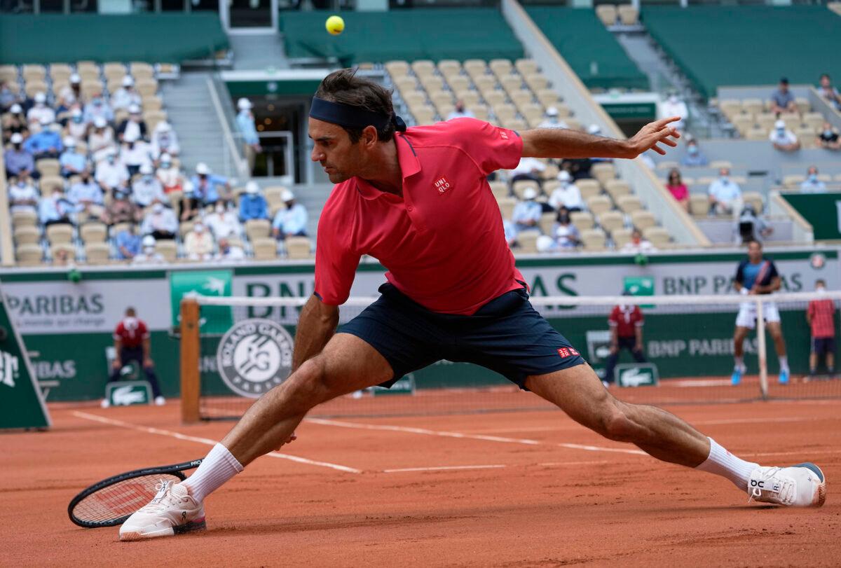 Roger Federer plays a return to Croatia's Marin Cilic during their second round match on day 5, of the French Open tennis tournament at Roland Garros in Paris, France, on June 3, 2021. (Michel Euler/AP Photo)